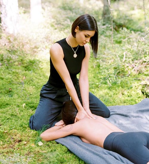 Smiling woman in a calm setting, suggesting a sense of well-being.